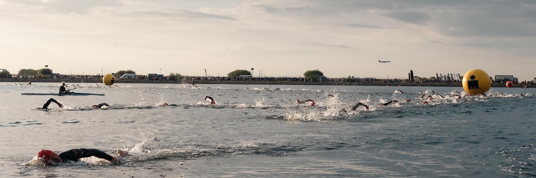 Athletes in the sea at the swim portion of IRONMAN Copenhagen in Denmark