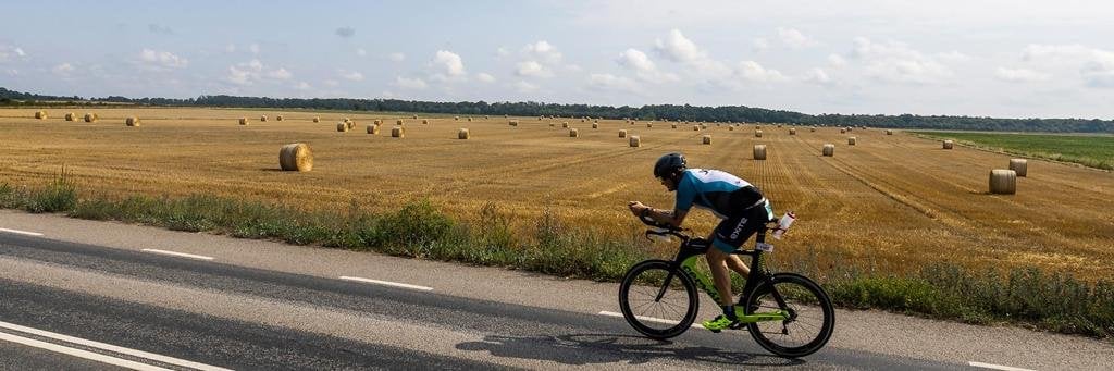 Single athlete on the bike portion on the countryside of IRONMAN Kalmar 