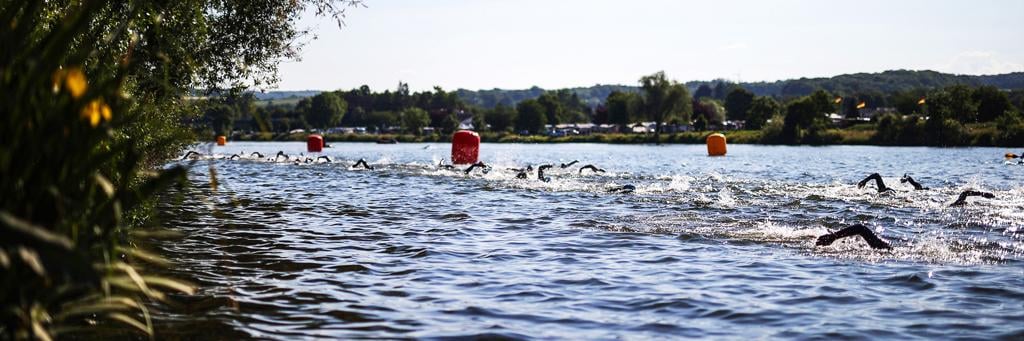 IRONMAN 70.3 Luxembourg athletes are swimming in the Moselle river which separates Germany and Luxembourg