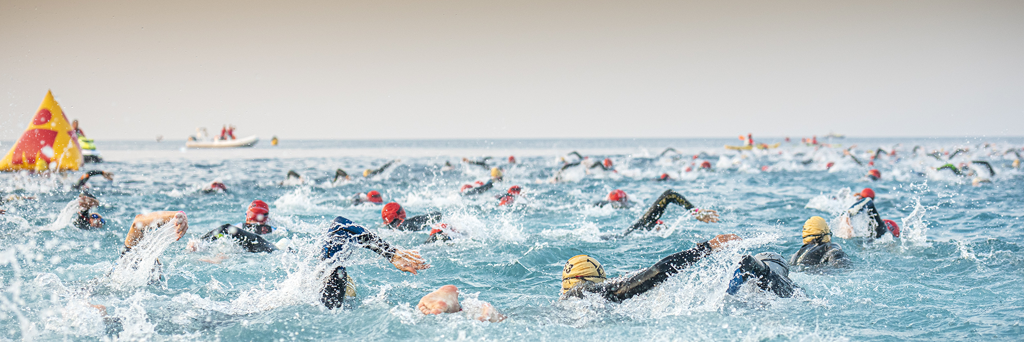 Swimmers participating in IRONMAN race