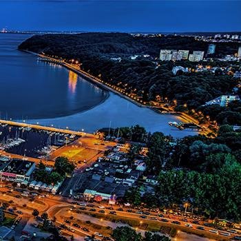 Gdynia port at night with city light glowing
