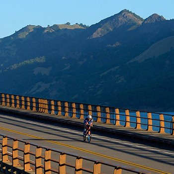 Triathlete biking scenic mountainous IM703 Santa Rosa