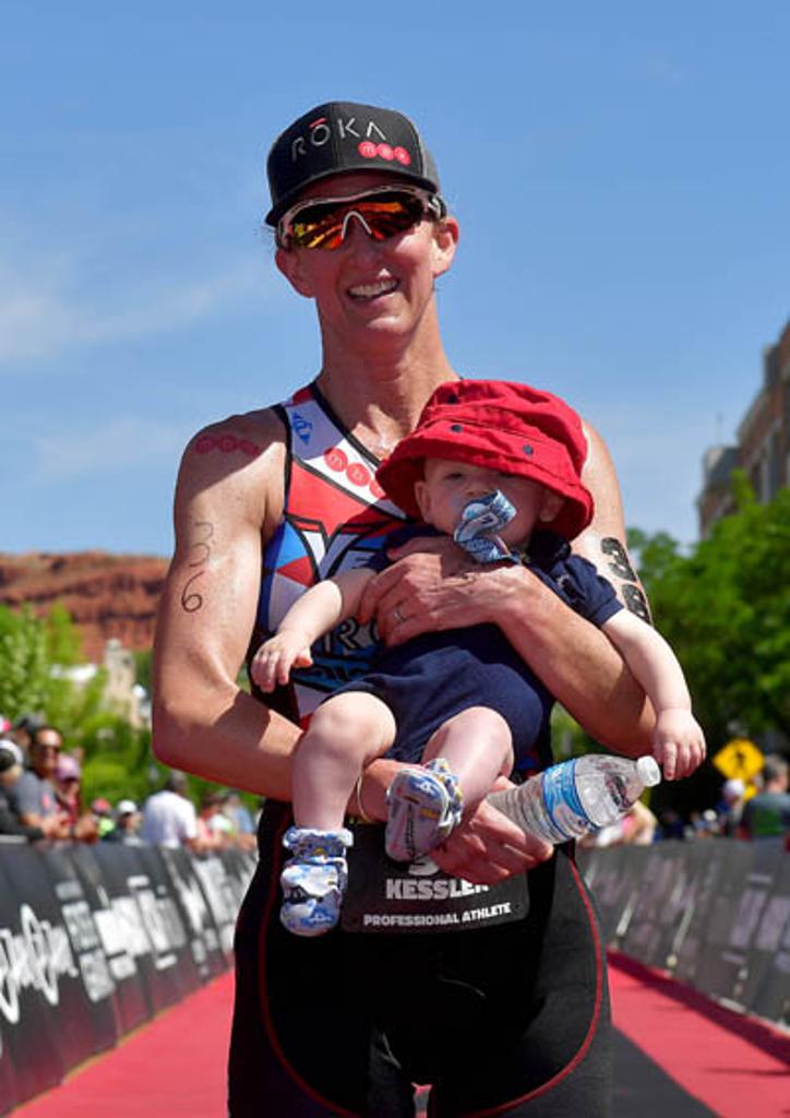 Meredith Kessler holding her son post race