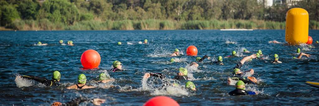 Athletes are swimming in blue waters of Germiston lake at 5150 Ekurhuleni in Gauteng