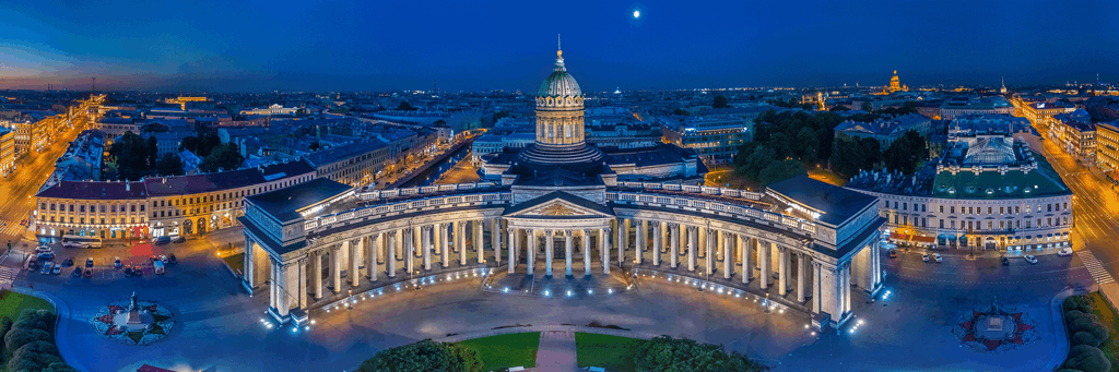 Wide angle image of Kazan Cathedral in St. Petersburg, Russia at night where streets and monuments are enlightened