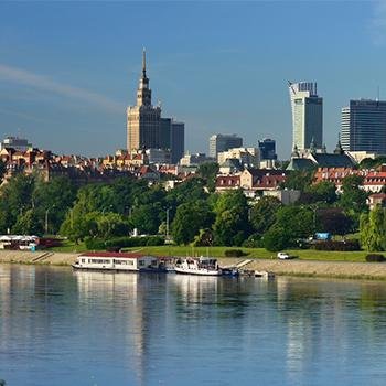 Warsaw skyline with buildings, towers and trees from the waterfront