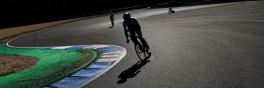IRONMAN 70.3 Portugal-Cascais athletes biking along curves