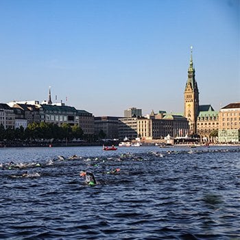 Athletes swimming in the Alster at IRONMAN Hamburg