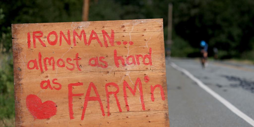 Sign near road reads"IRONMAN... almost as hard as FARM'n"
