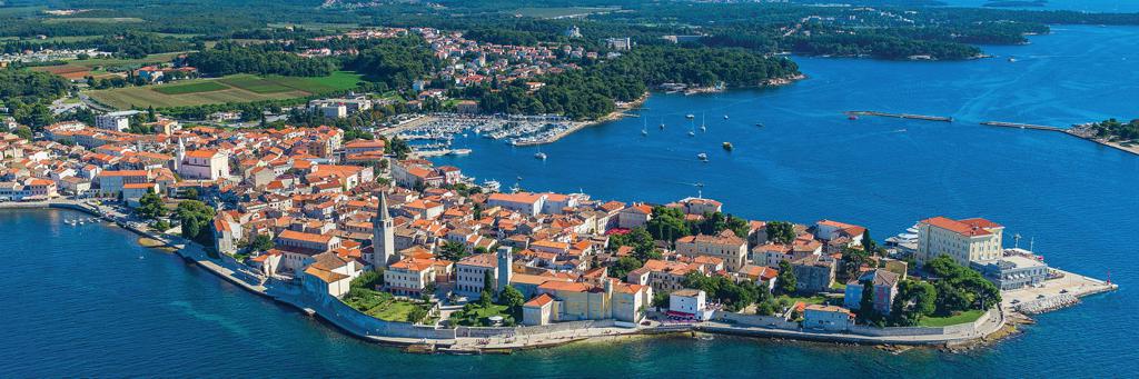 Bird's eye view of the city of Porec, which is set around a harbour protected from the crystal clear sea 
