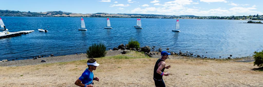 Runners along the Lake Taupo foreshore