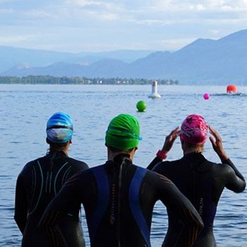 Triathletes in front of water IM Canada