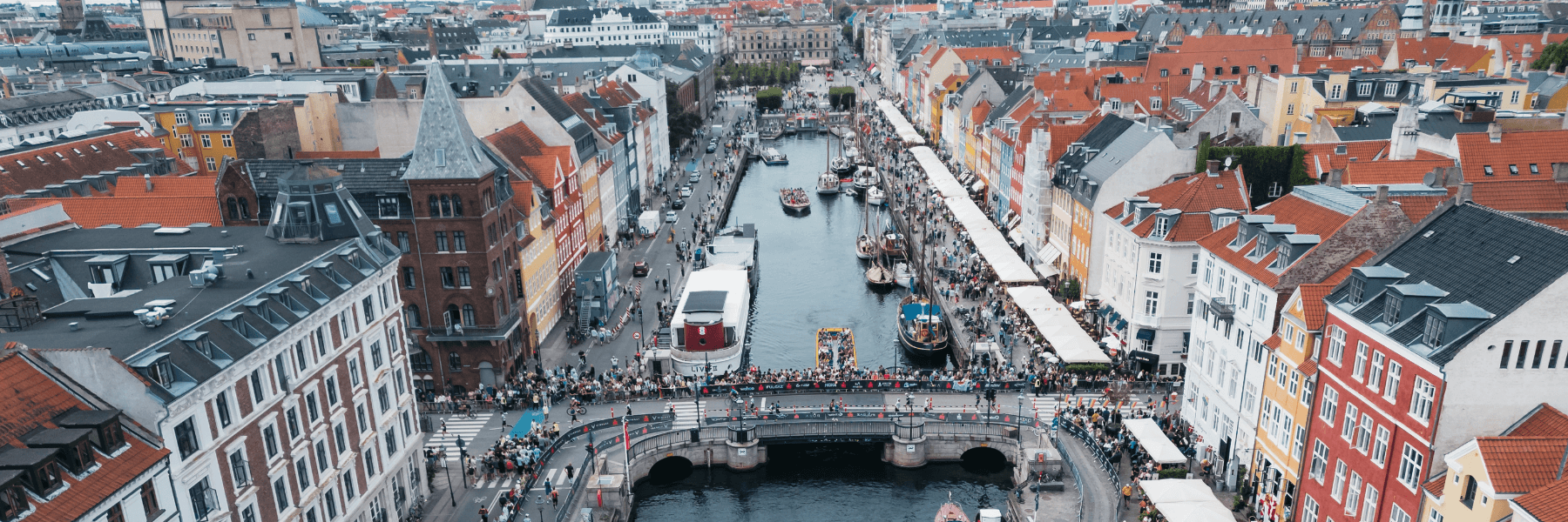 IRONMAN Copenhagen athletes passing by and getting cheered on by supporters in Denmark