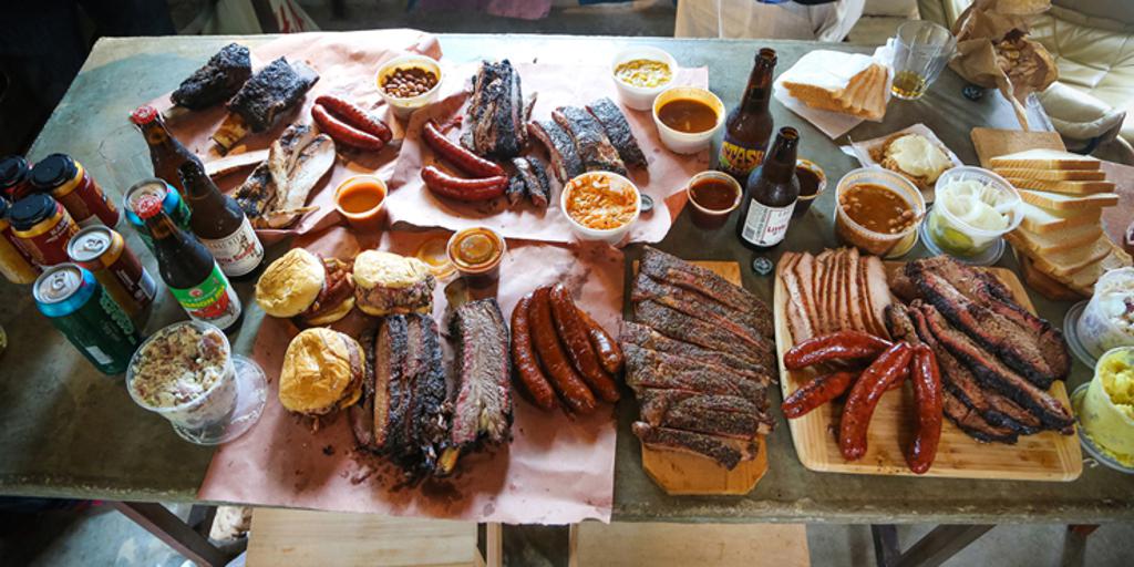 Barbeque-style food on a long table