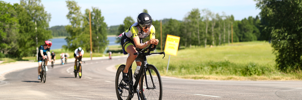 athletes on their bike riding across the country in Lahti, Finland at IRONMAN 70.3 Lahti