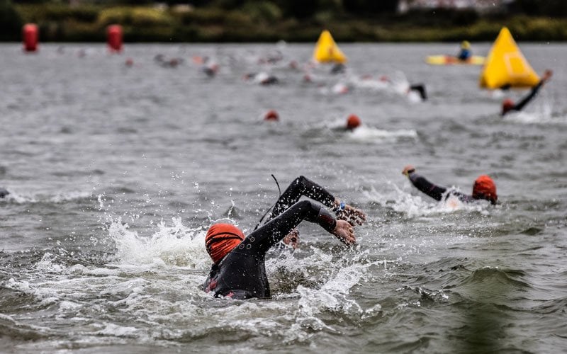 Athletes swimming in the Maas at IRONMAN Maastricht-Limburg