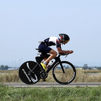 An athlete biking through the countryside at IRONMAN 70.3 Italy Emilia-Romagna