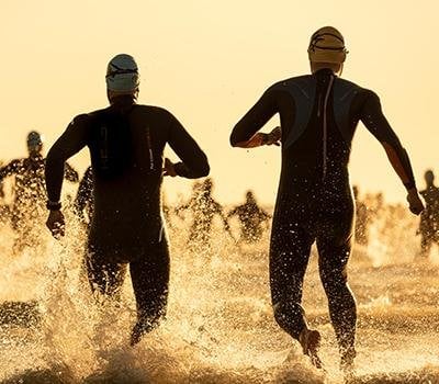 Athletes entering the ocean